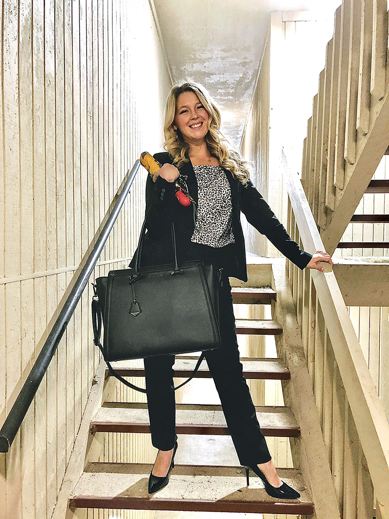 Emma dressed for success on stairs on her way out the door for work.