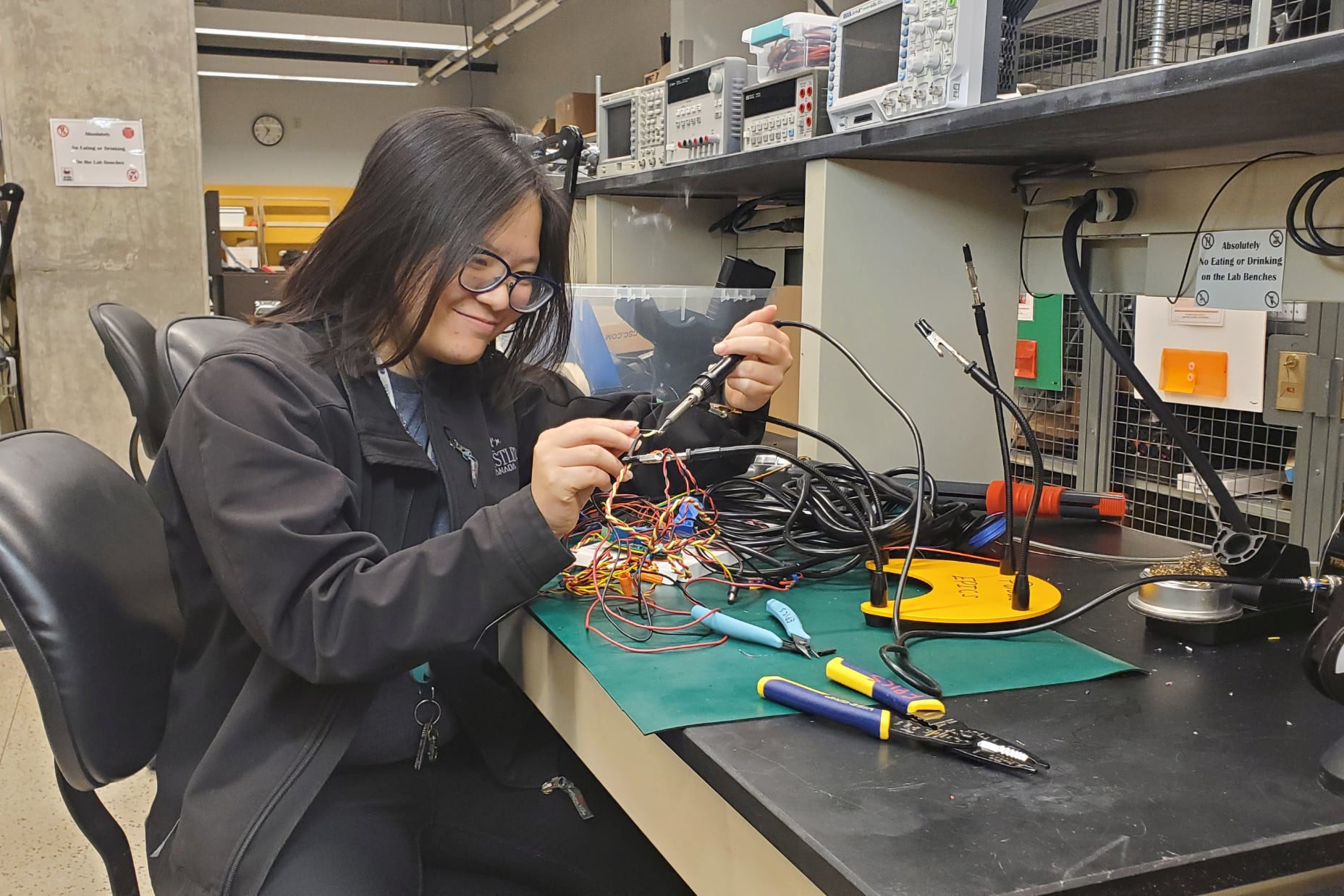 Student Hana Wong at laboratory bench 