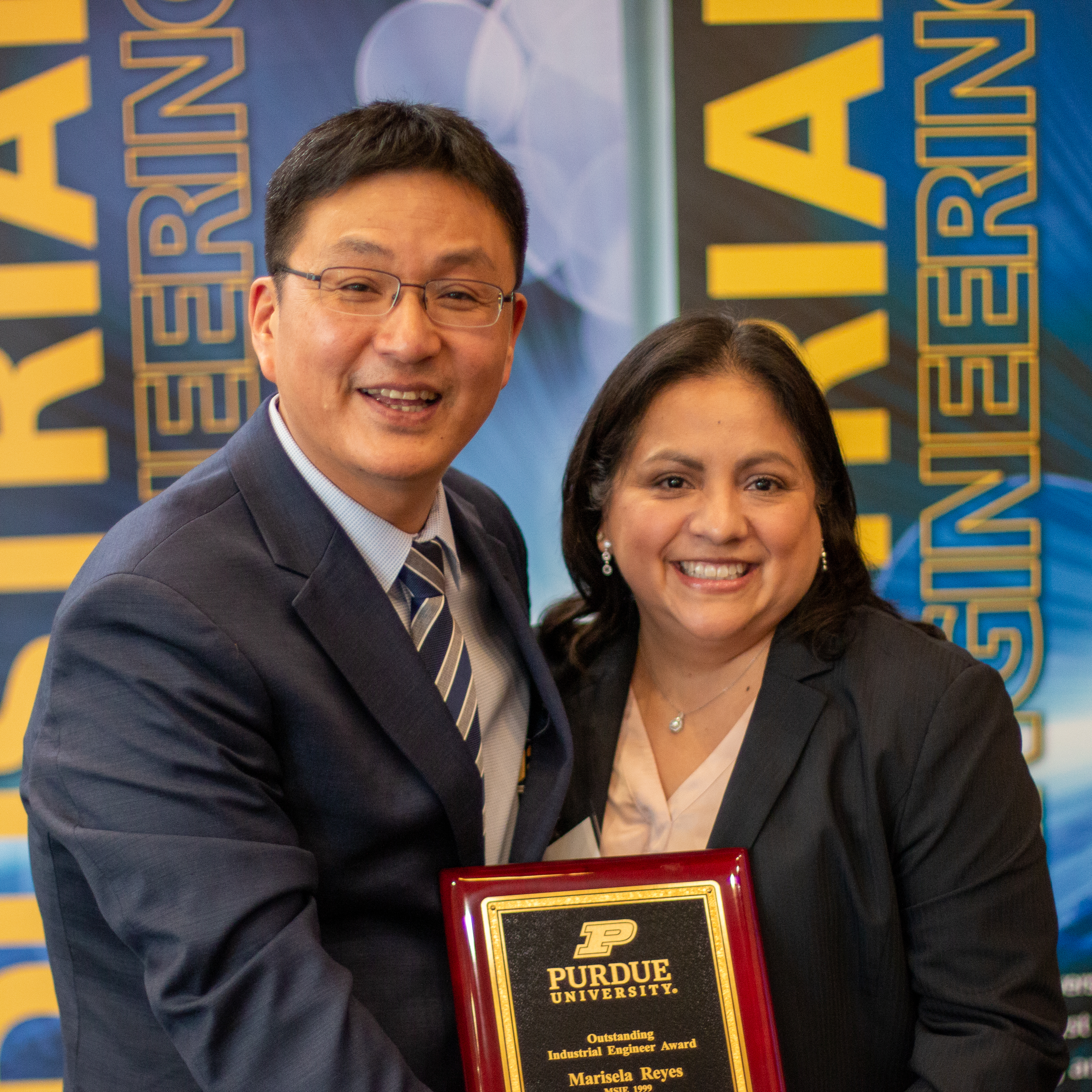 Marisela poses with Dr. Son after accepting award. 