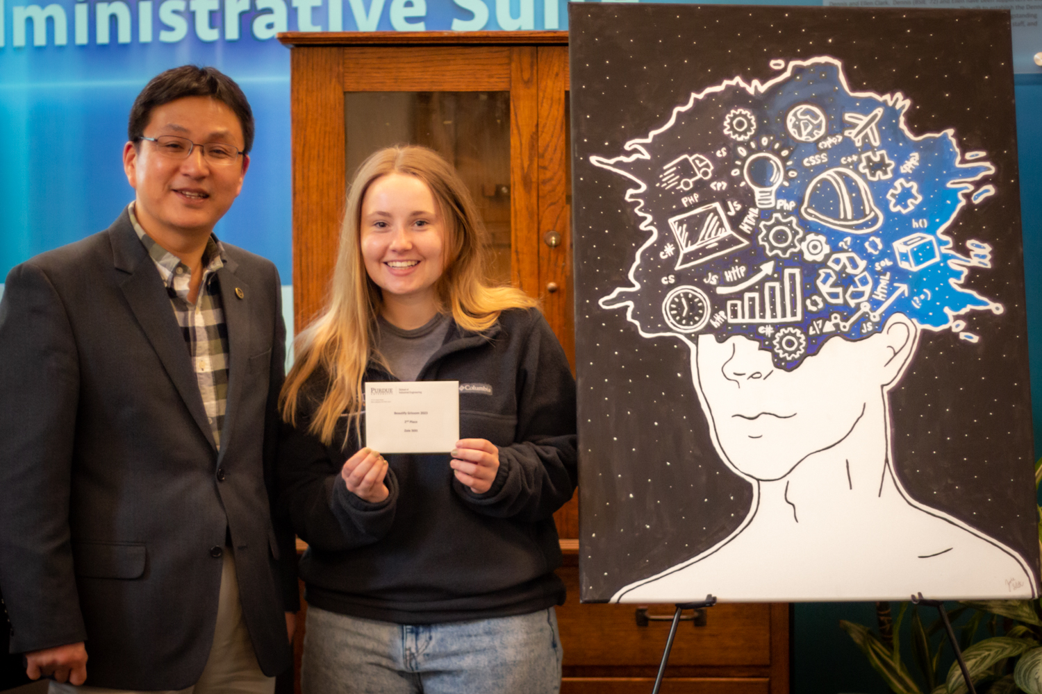 2nd place winner Zoie Stitt poses with Dr. Son