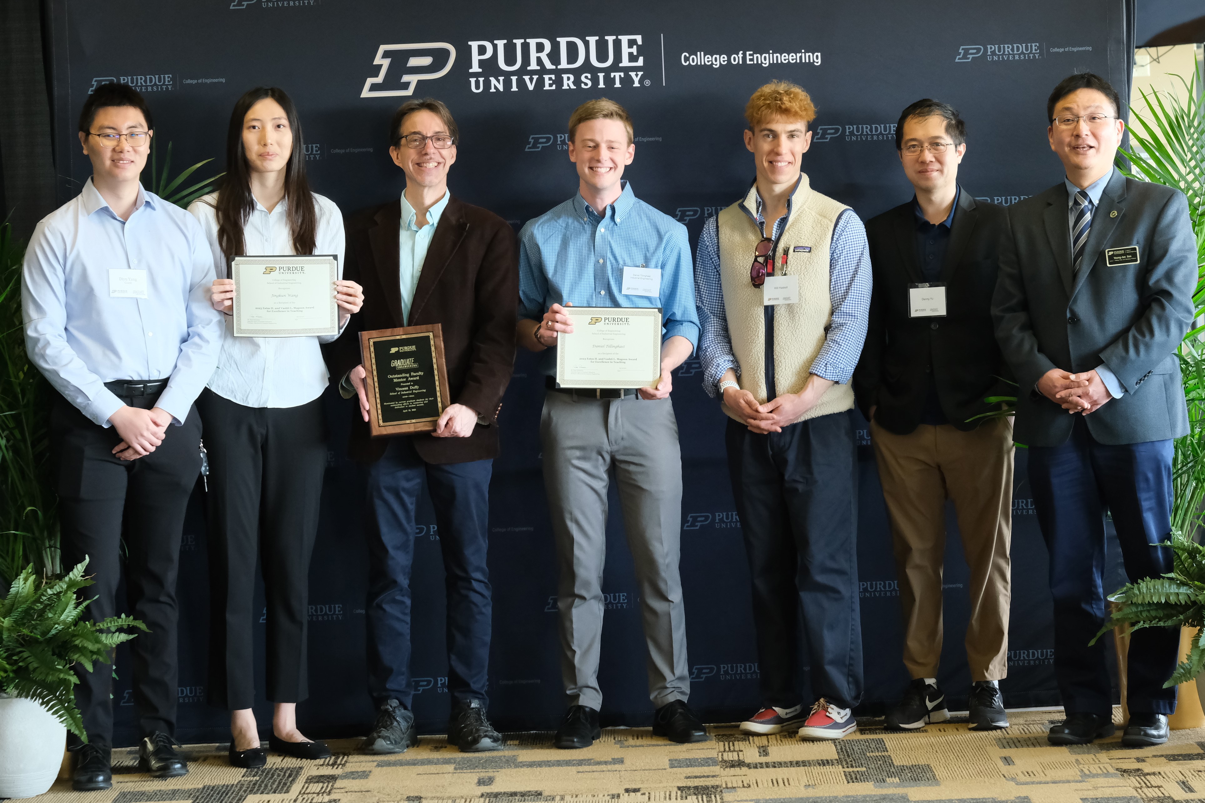 Grad students & faculty pose with awards