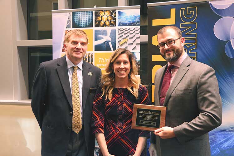 Photo of Erin Gough receiving 2018 Outstanding Staff Award